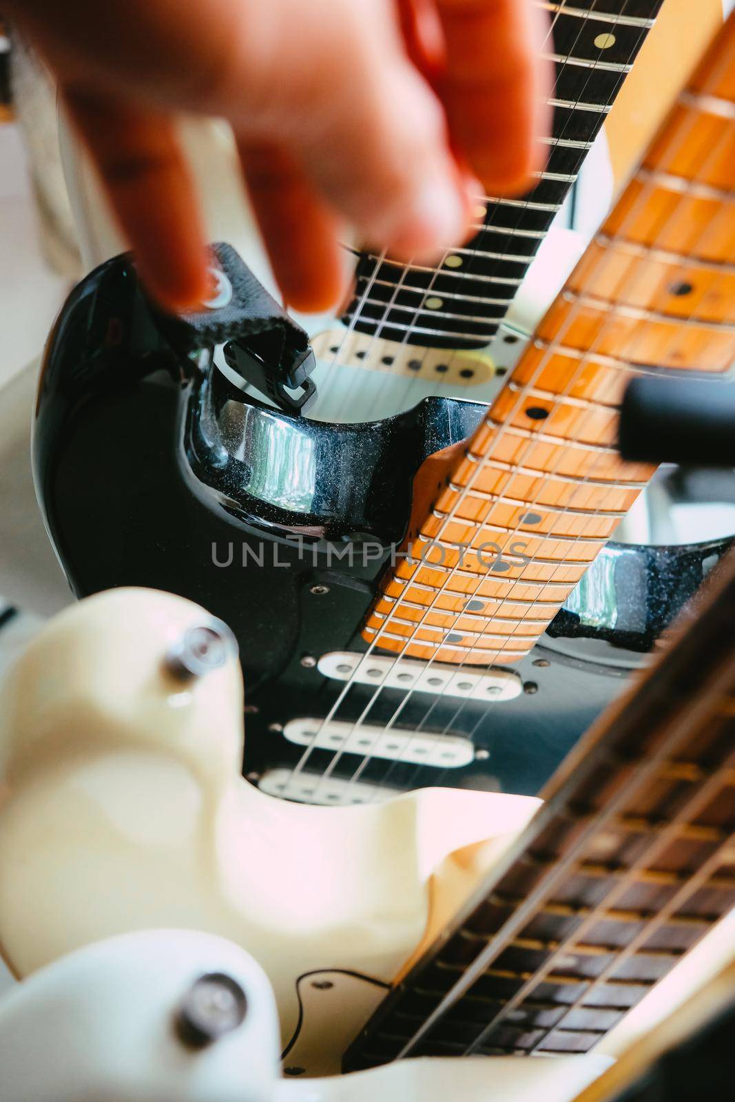 Hand picking up guitar by ponsulak