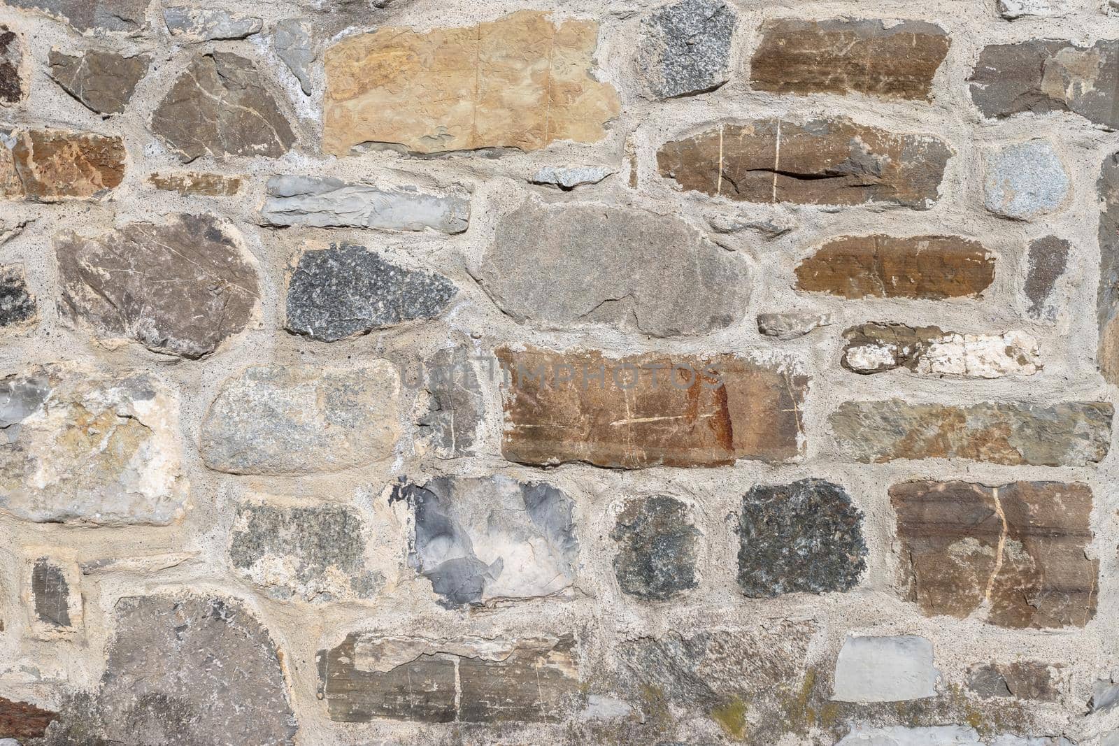 Old ancient brick wall, old texture of stone blocks closeup.