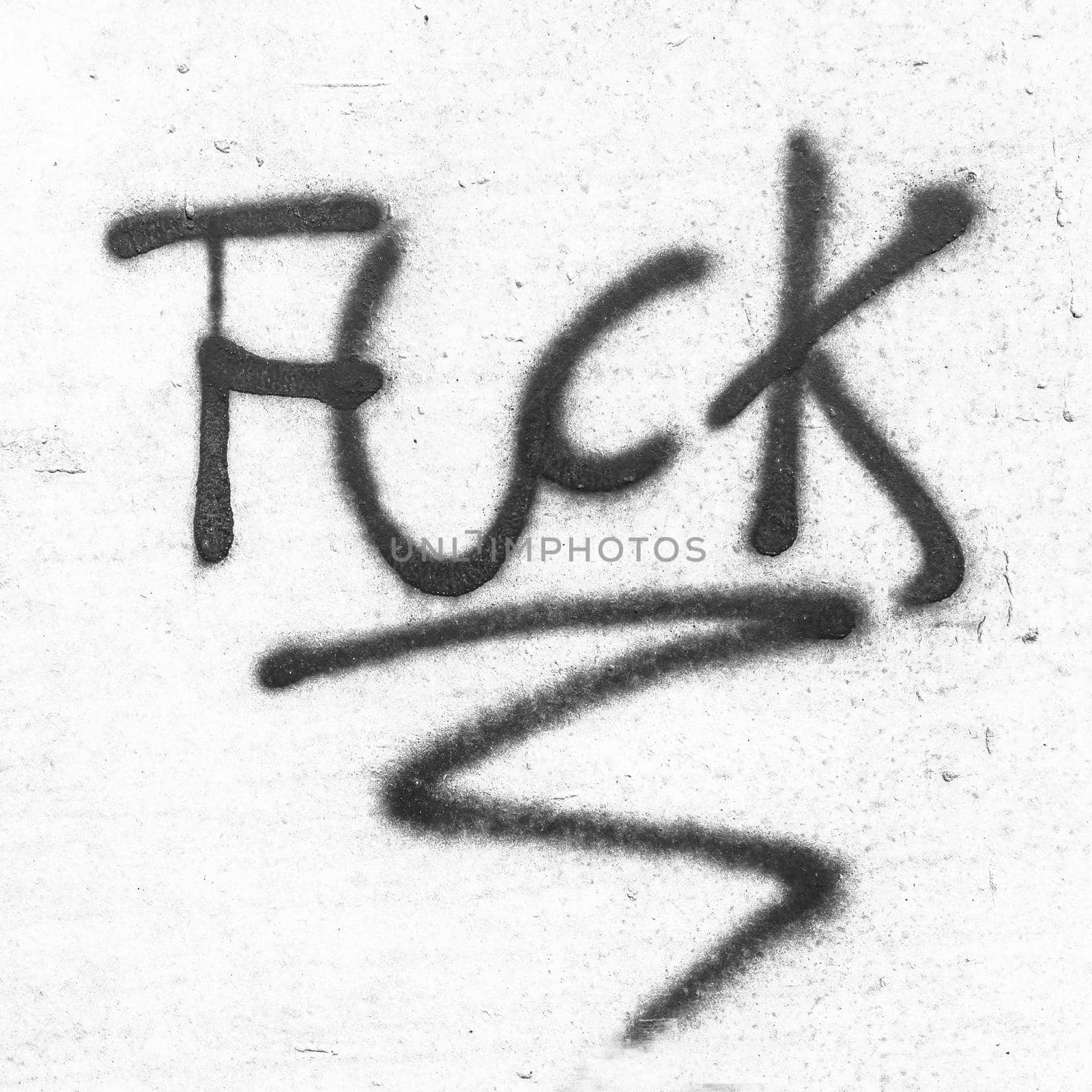 Fuck painted on concrete wall. Graffiti, texture, message, quote, anger concept.