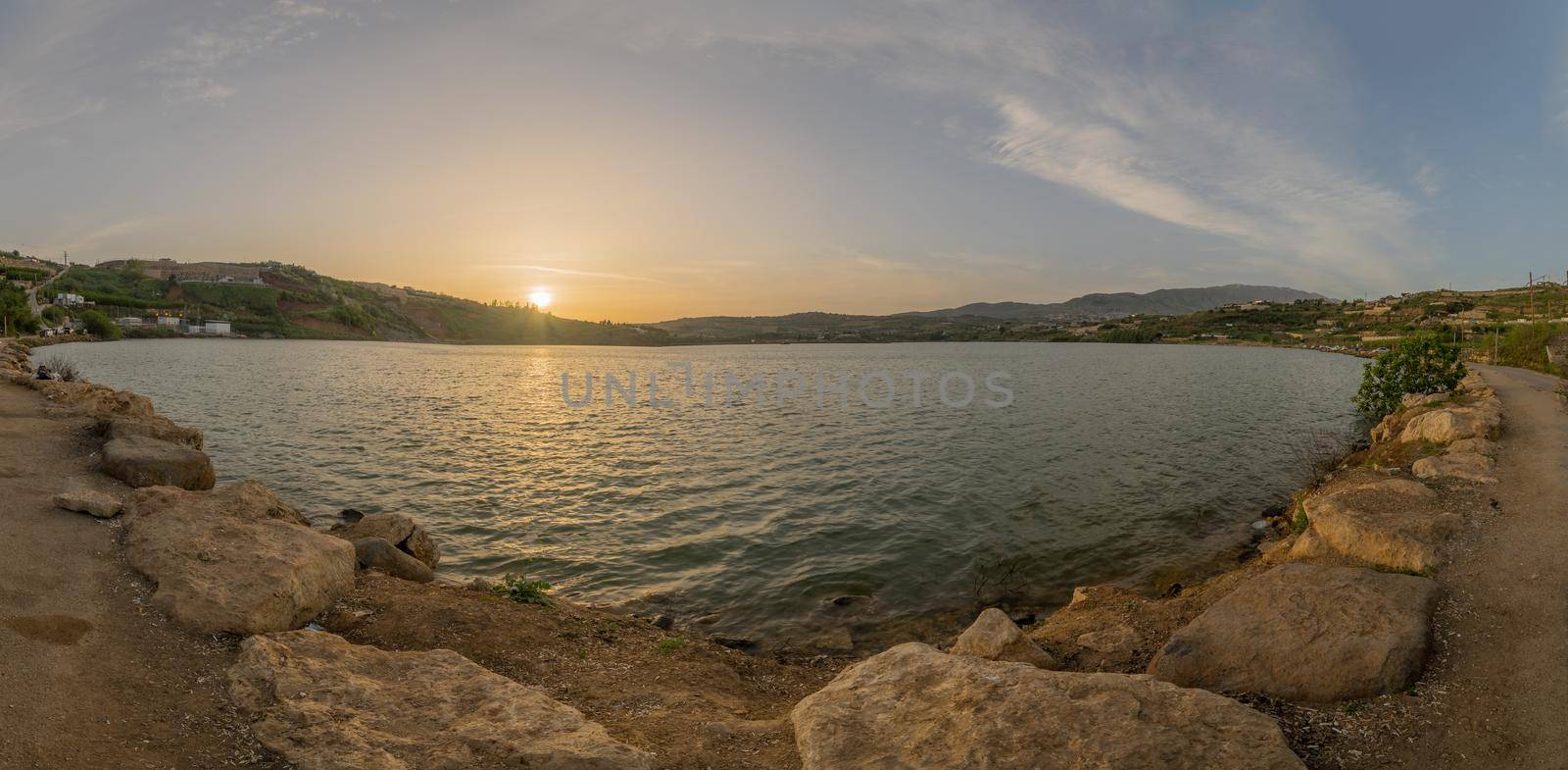 Panoramic sunset view of Lake Ram (Ram Pool) in the Golan Heights, Northern Israel
