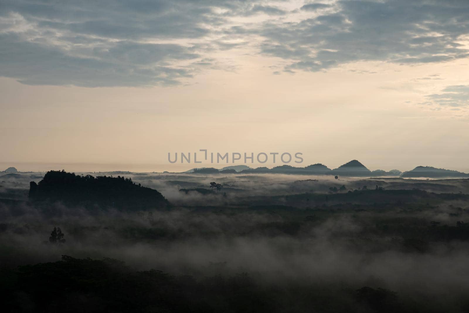misty morning sunrise, Landscape view of Khao Na Nai Luang temple on peak mountain at Surat Thani Province, Southern of Thailand