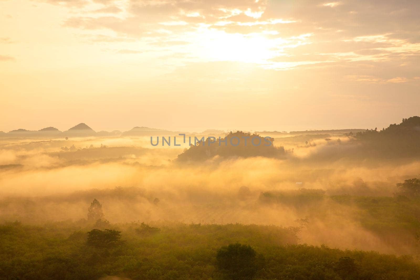 misty morning sunrise, Landscape view of Khao Na Nai Luang temple on peak mountain at Surat Thani Province, Southern of Thailand