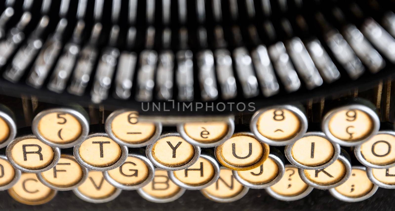 the keys of an old typewriter seen from above. Mechanical tools for writing. Old time journalism