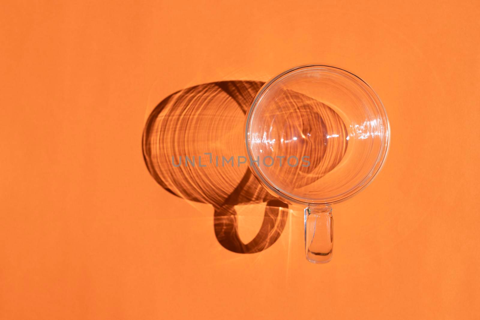 a circle with a hard shadow on a colored background. High quality photo