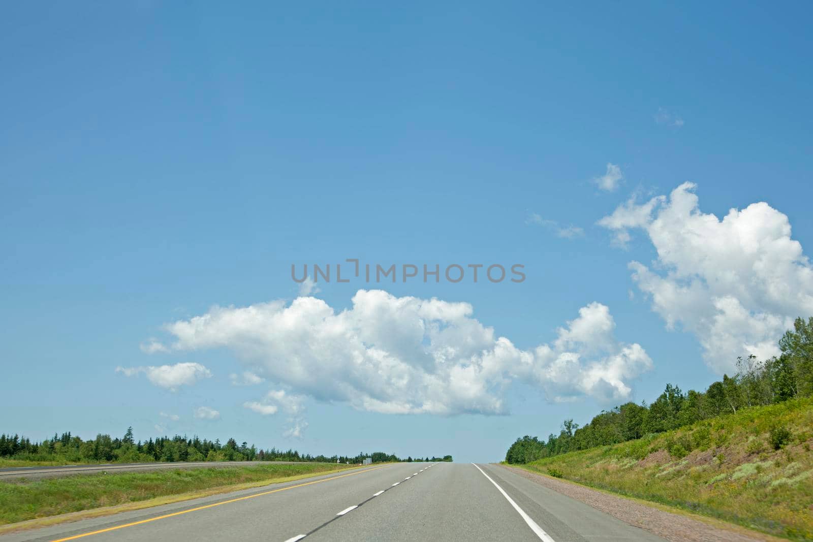 Stretch of open highway on a summer day by rustycanuck