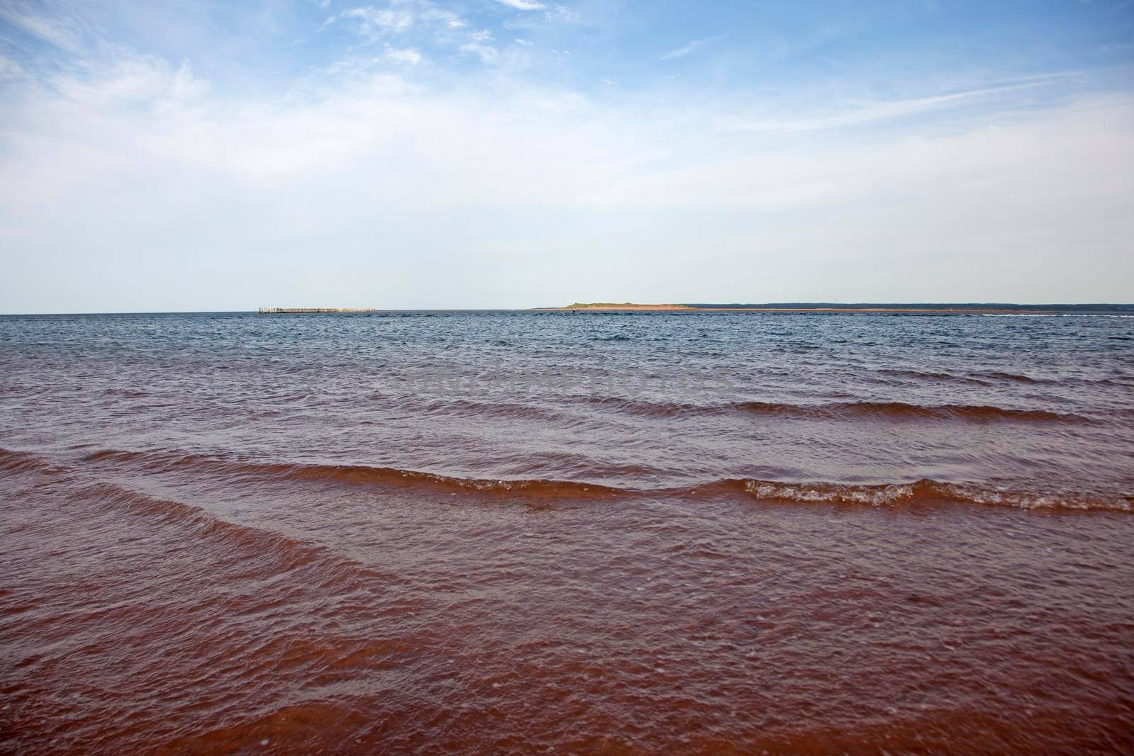 The reddish waters mixed with ocean in Prince Edward Island 