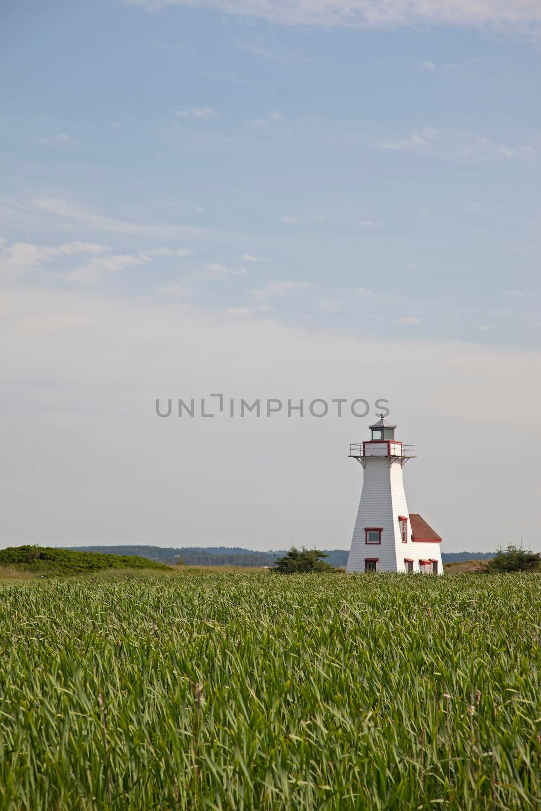 July 27, 2019 -French River, PEI - French River's iconic lighthouse near the ocean in PEI 