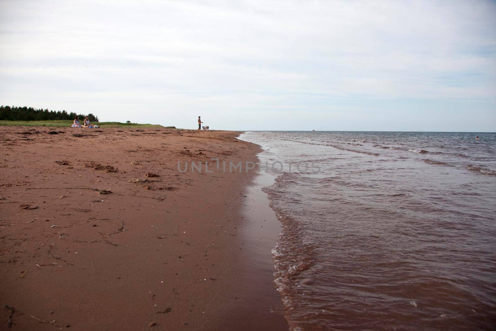 Kensington, PEI- July 27, 2019 - A few tourists and locals on the beach on a hot summer day in Prince Edward island 