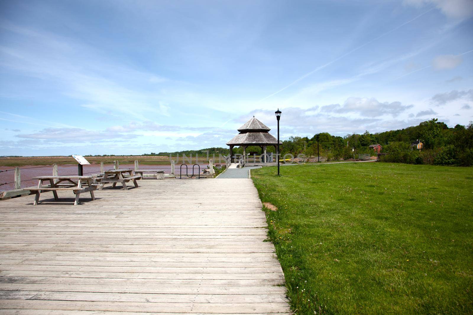 A brown gazebo by the waterfront in Wolfville, Nova Scotia