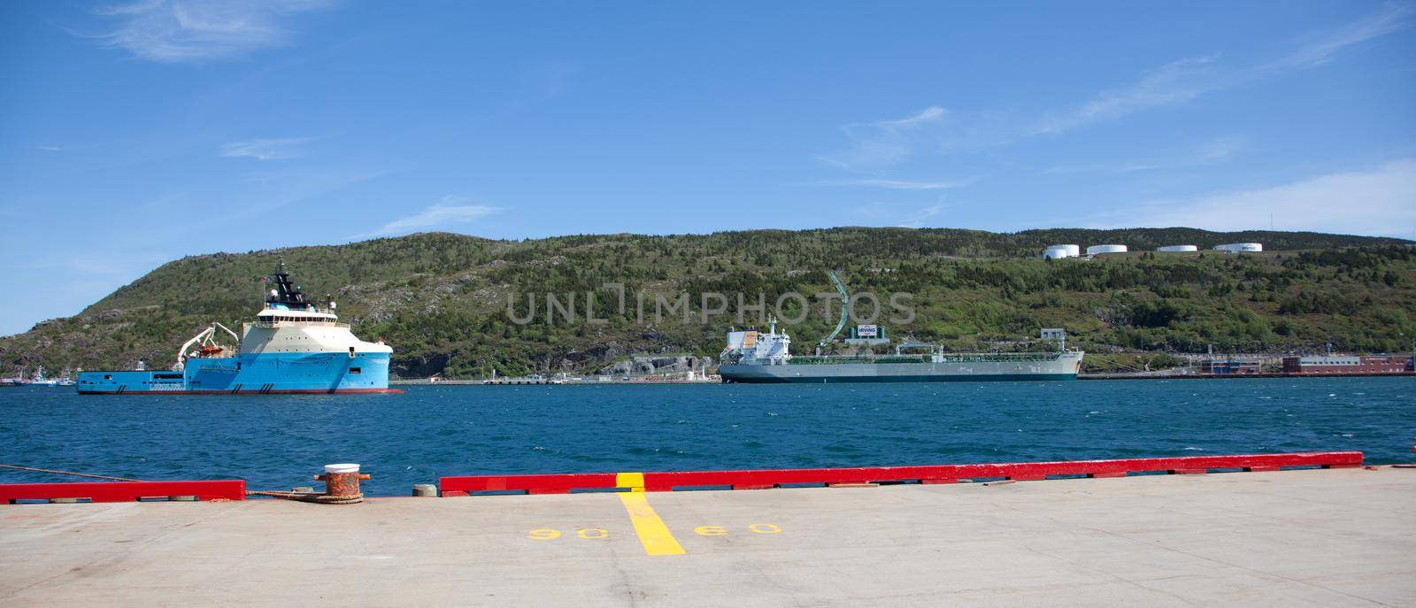  June 23, 2018- St. Johns, Newfoundland: Across the St. Johns, Harbour, the tug supply vessel Maersk Cutter is visible beside an Irving Refinery