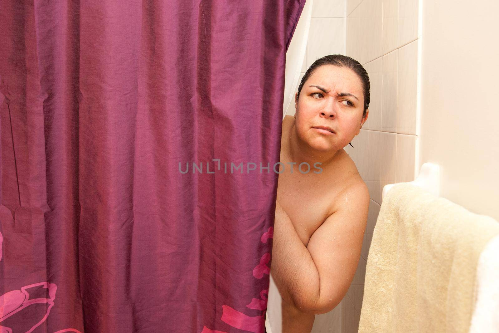 Nervous woman in shower  by rustycanuck