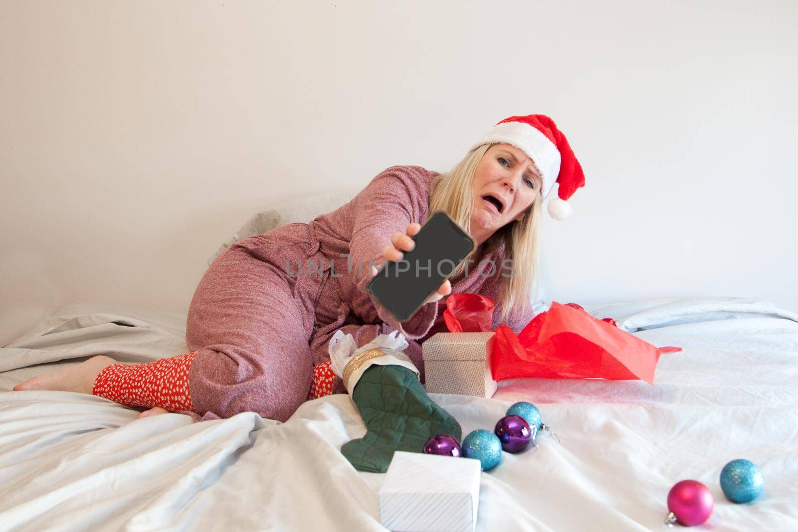 woman's lonely christmas with cell phone  by rustycanuck