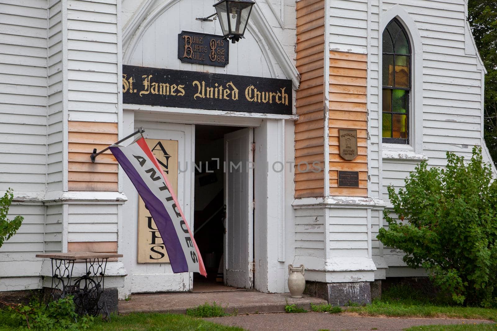 August 18, 2019 - Great Village, Nova Scotia - in the summer months the St James United church building is rented to antique sellers 