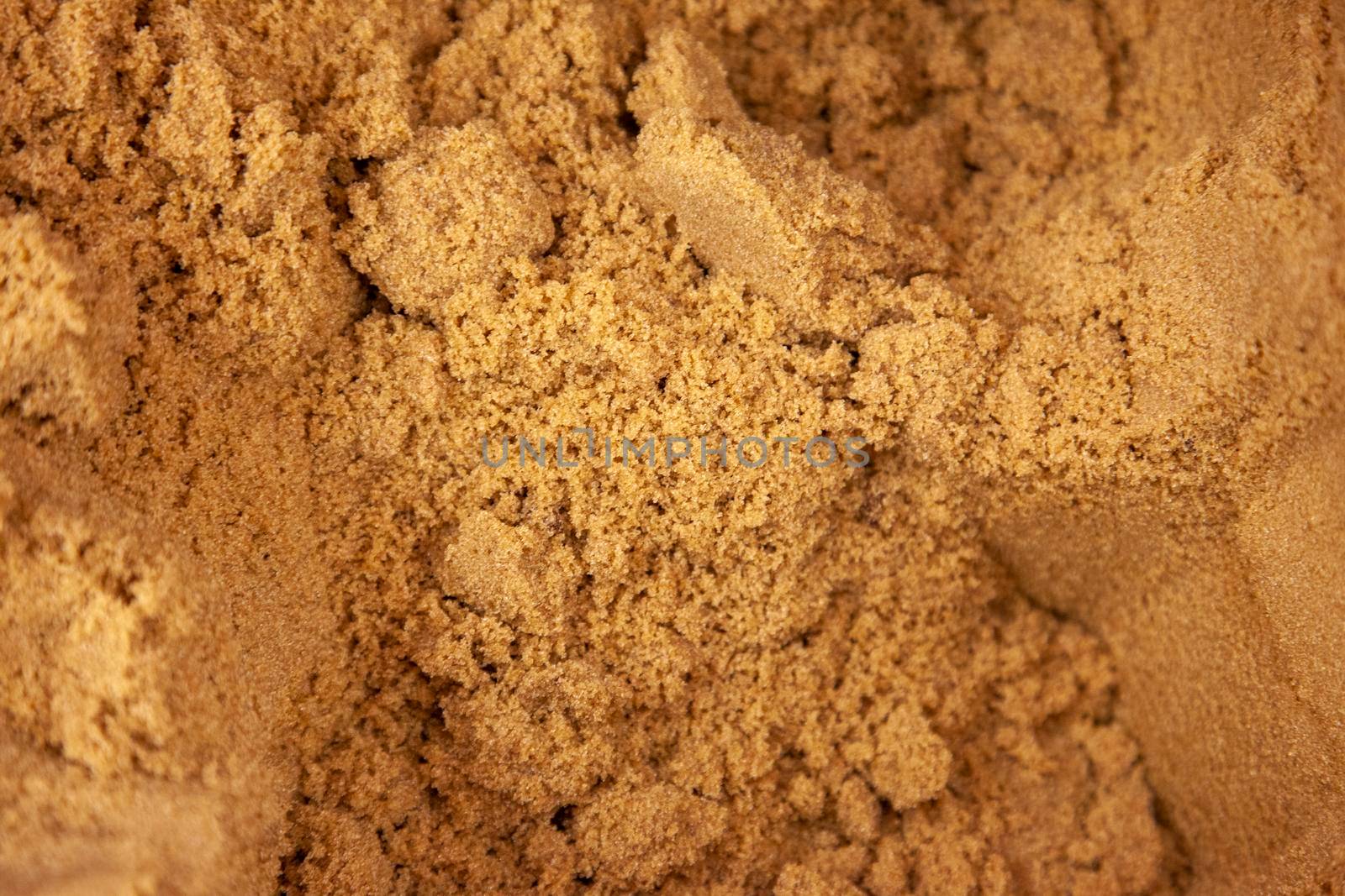  packed mounds of dark brown sugar granular 