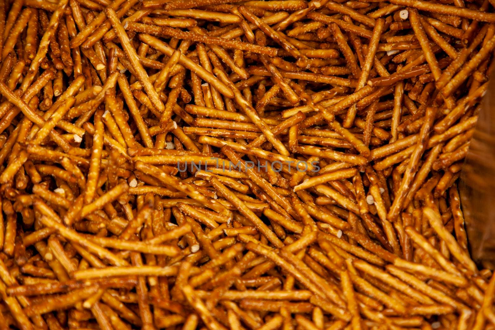  salt coated delicious looking snack sticks made of pretzels 