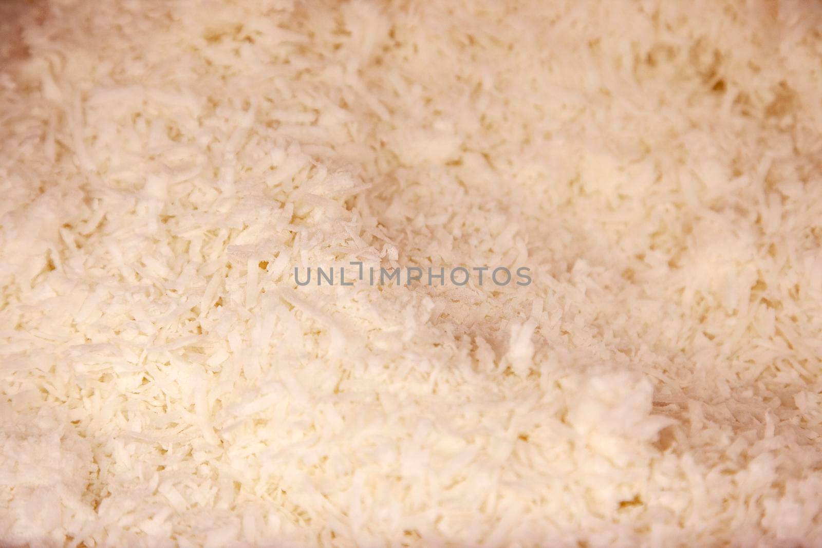  white shredded coconut in a bin for eating or baking 
