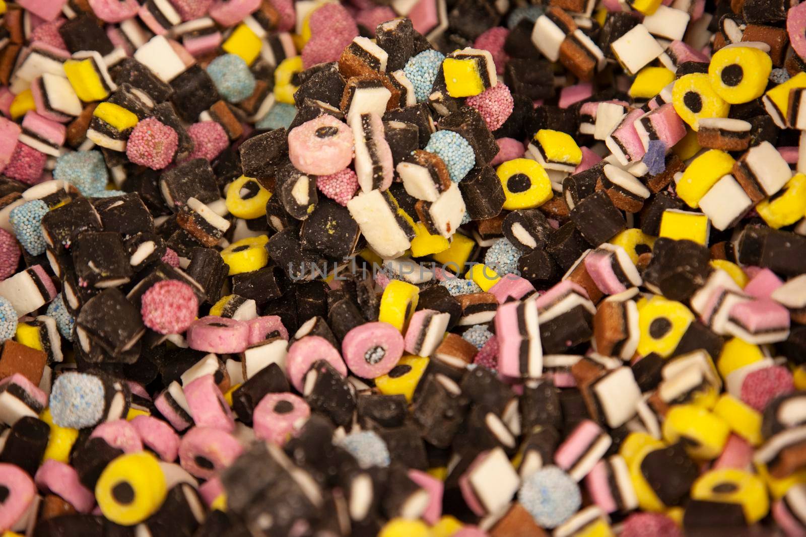 pink and black and white colored liquorice candies 