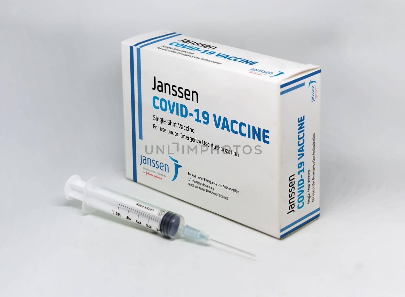 New York, USA, April 12th 2021: A syringe next to the Janssen Covid-19 vaccine box. Janssen is a subsiadiary company of Johnson and Johnson and devoloped the first single-shot Covid-19 vaccine