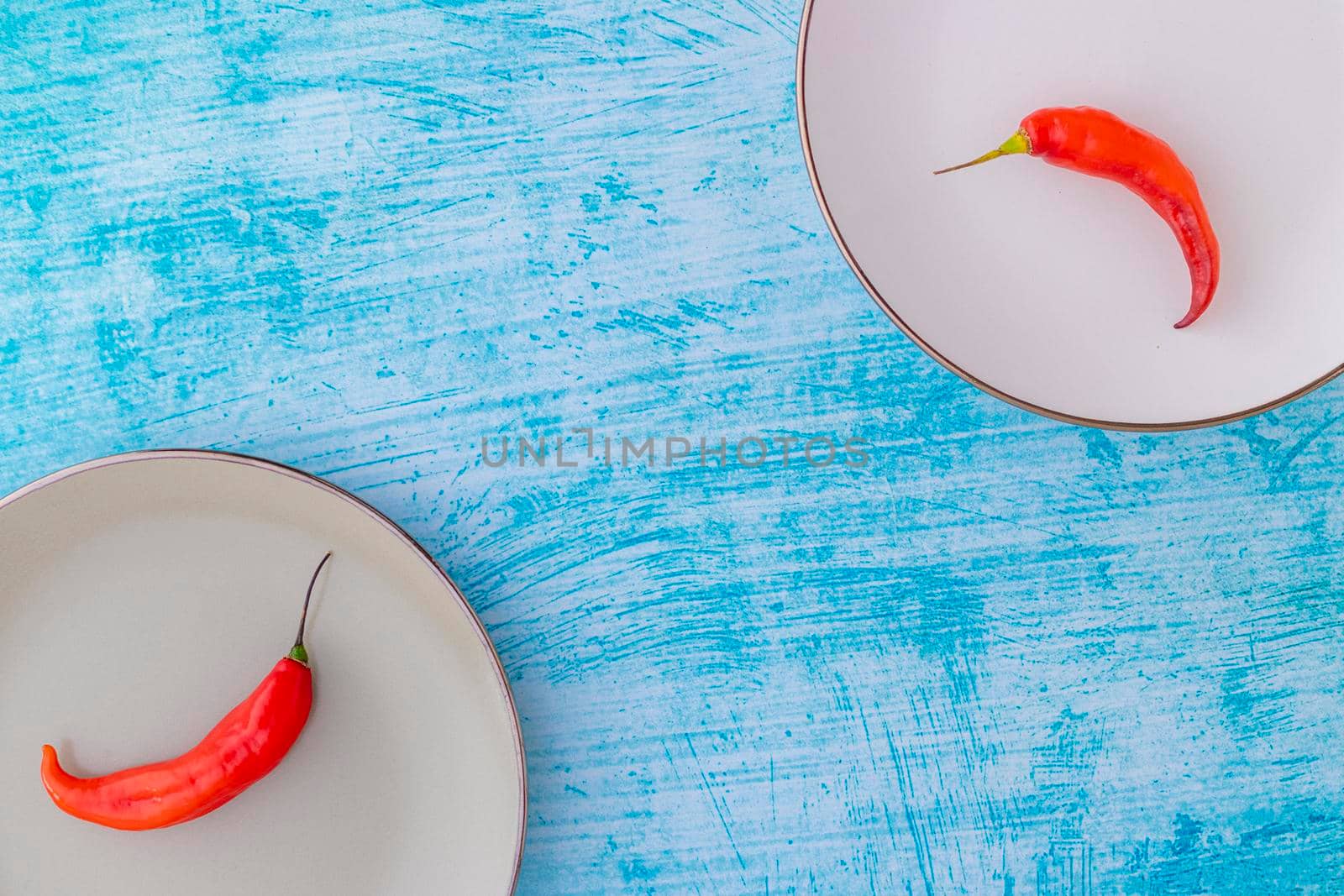 Presentation of the Peruvian red hot chili (Ají Limo) in a colored plate