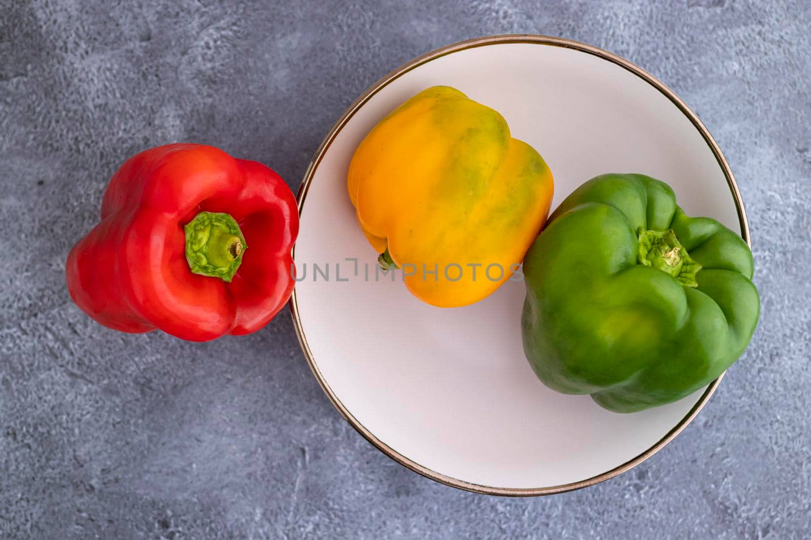 Aerial view of red, green and yellow peppers