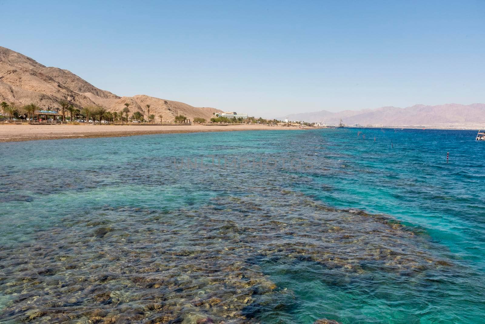 A view of the coral reef above the water. The Red Sea. Beach in the city of Eilat, Israel High angel by avirozen