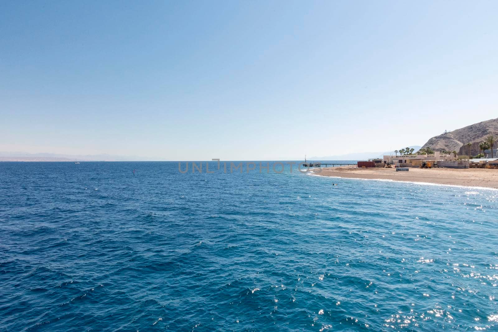 A view of the coral reef above the water. The Red Sea. Beach in the city of Eilat, Israel High angel. High quality photo