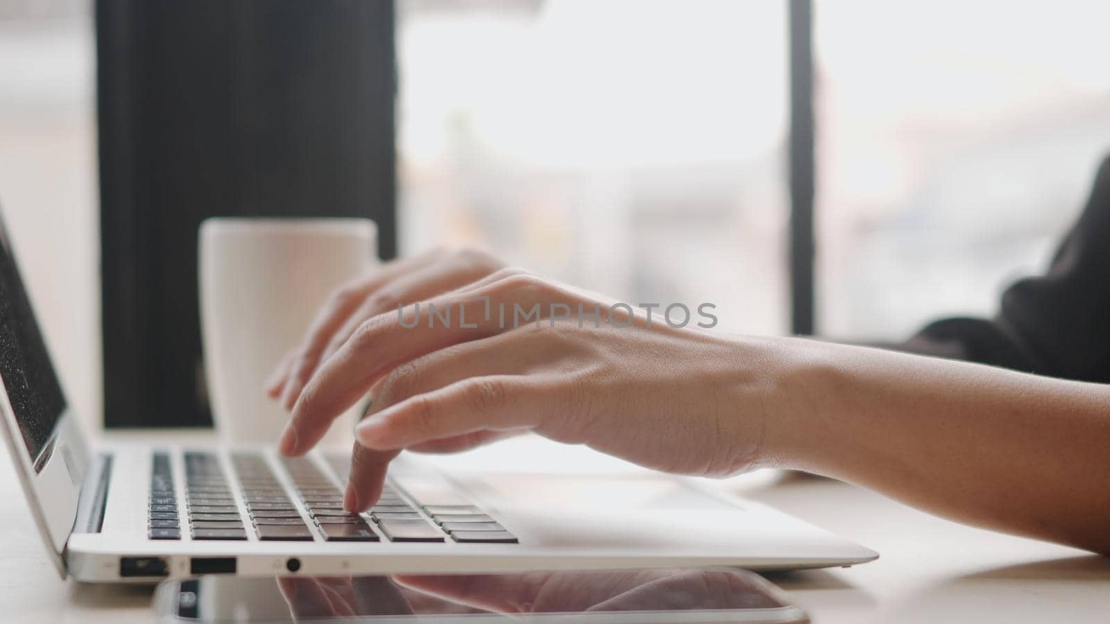 businesswoman working typing on laptop computer keyboard by Sorapop