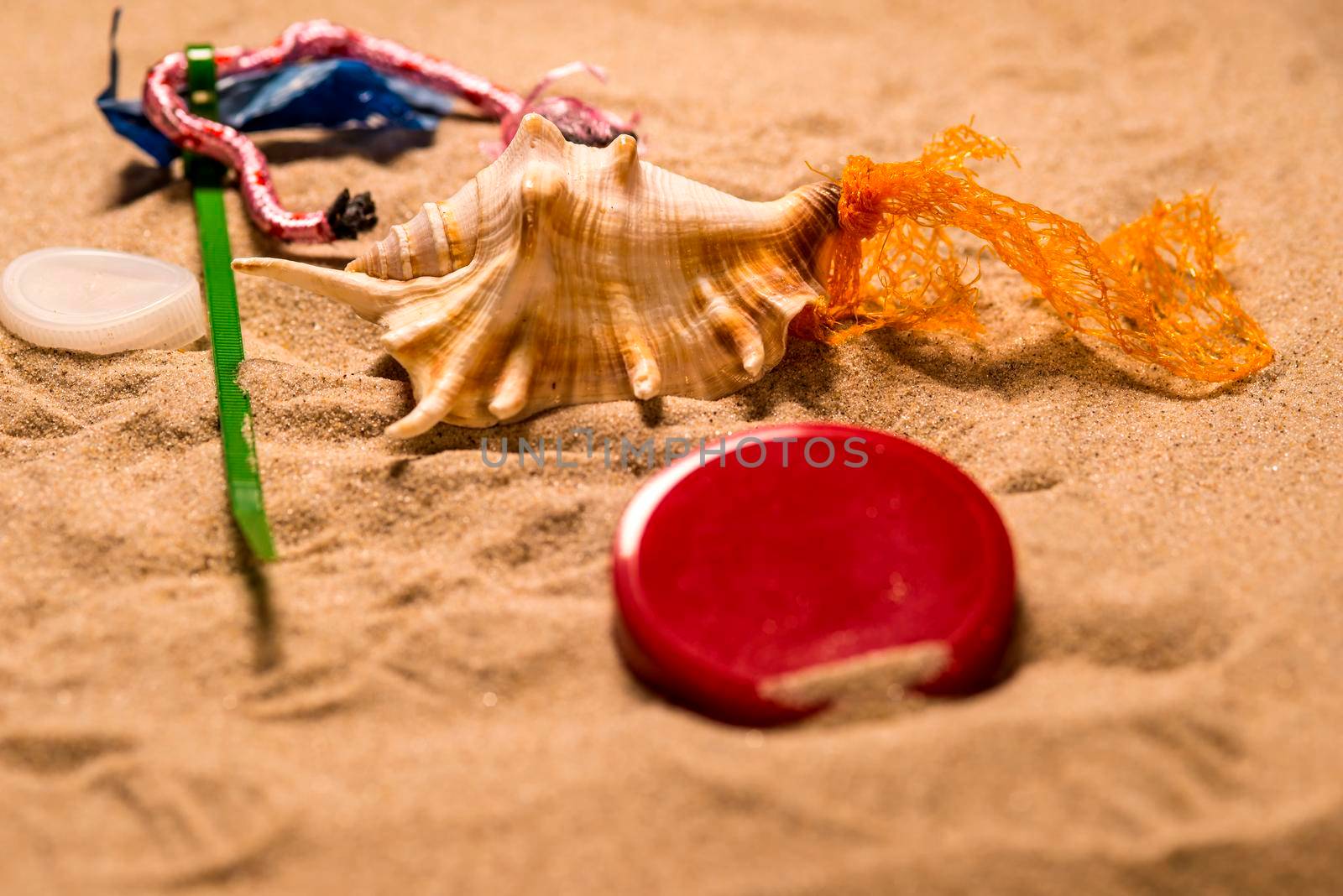 plastic pollution on a beach by Jochen