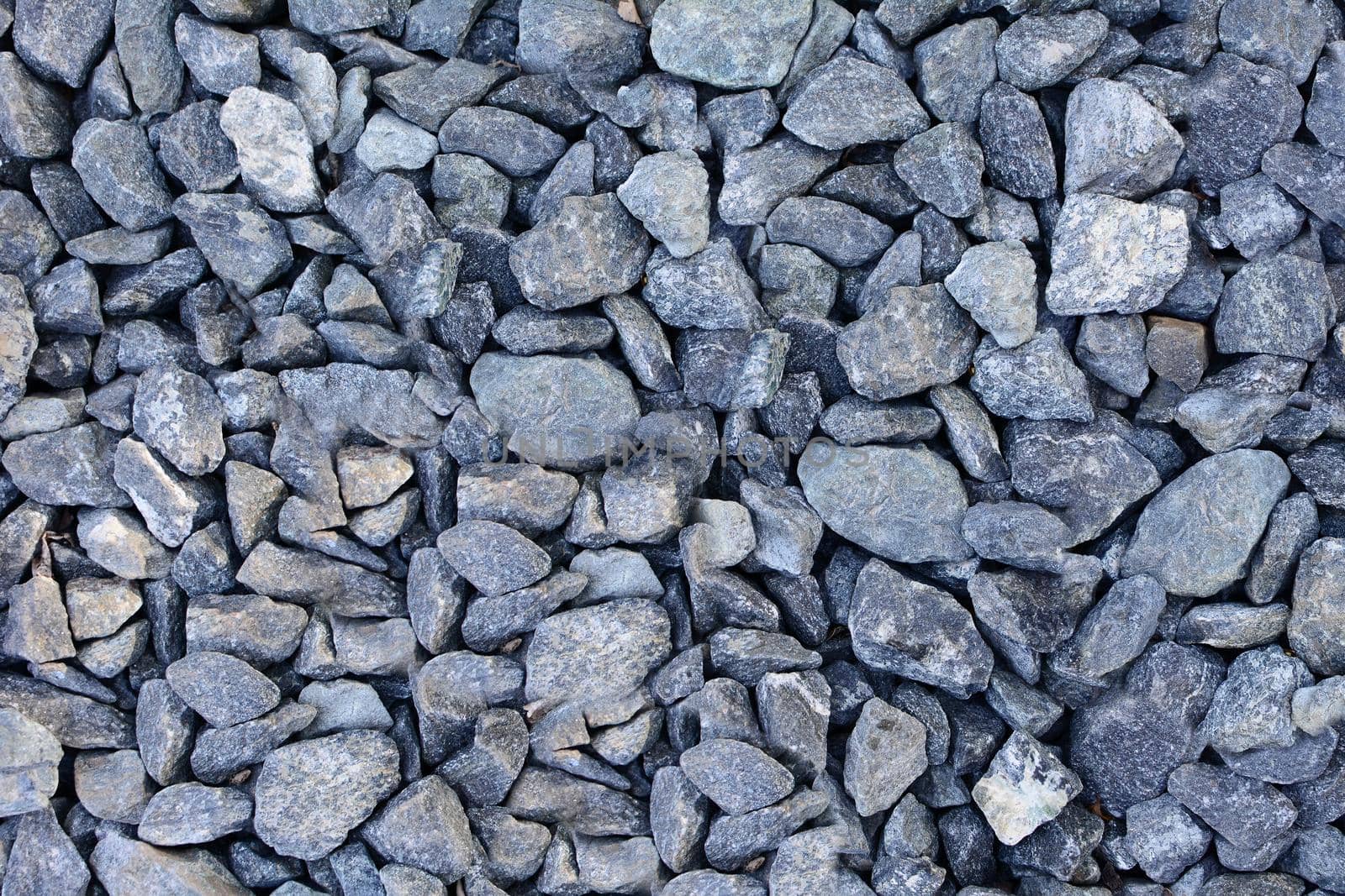 Background of gray gravel. Full frame gray gravel texture and pattern.