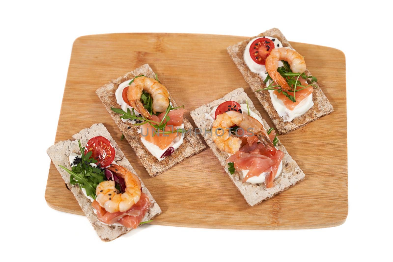  Delicious sandwiches with shrimp, salmon and tomatoes.  by SerhiiBobyk