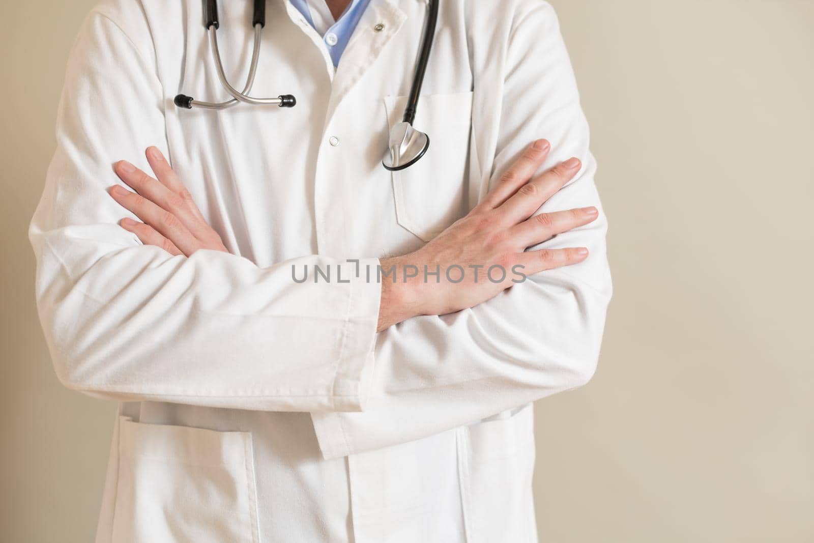 Portrait of male doctor with arms crossed.