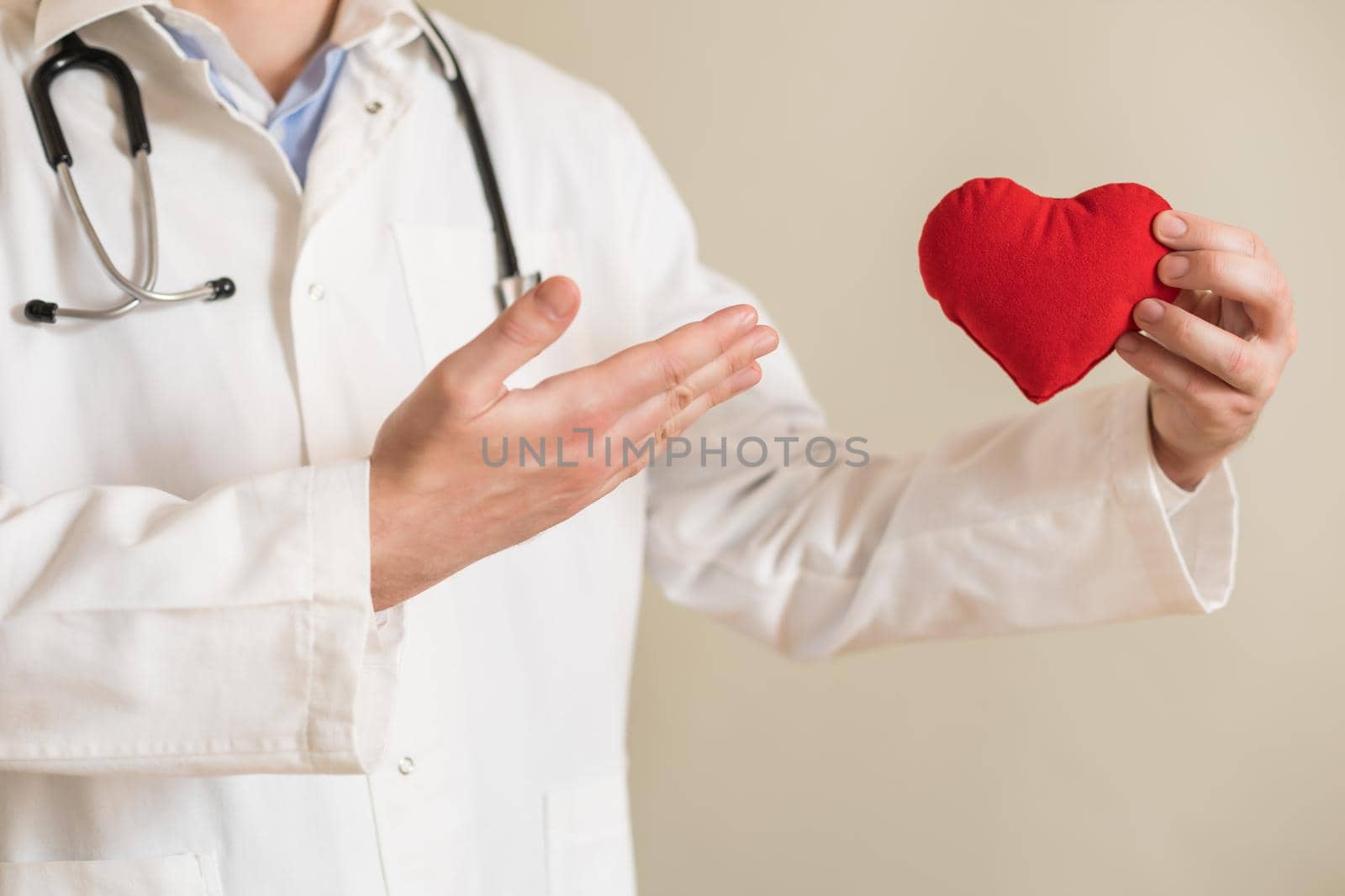 Male doctor showing heart shape by Bazdar