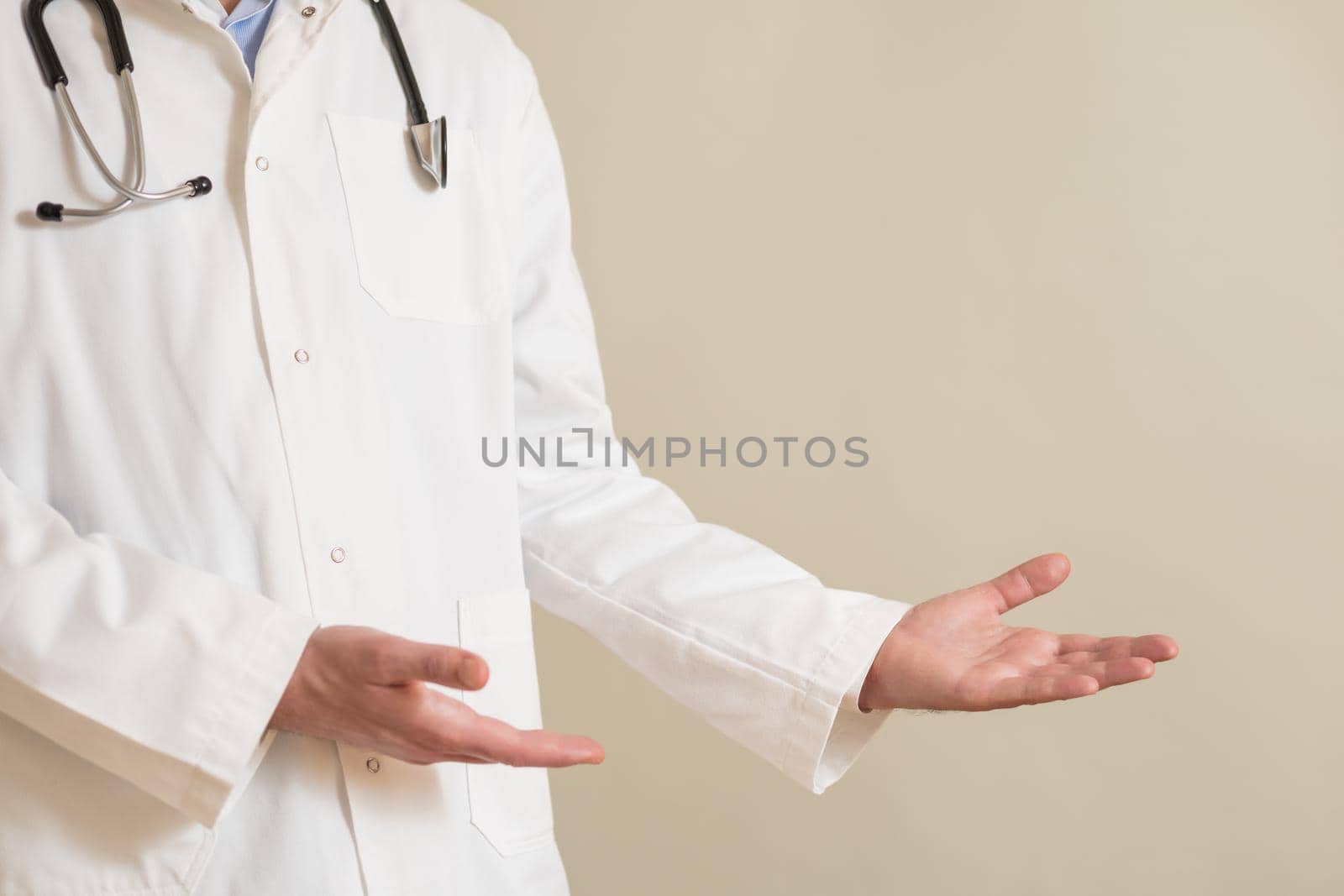 Male doctor showing showing welcome gesture by Bazdar