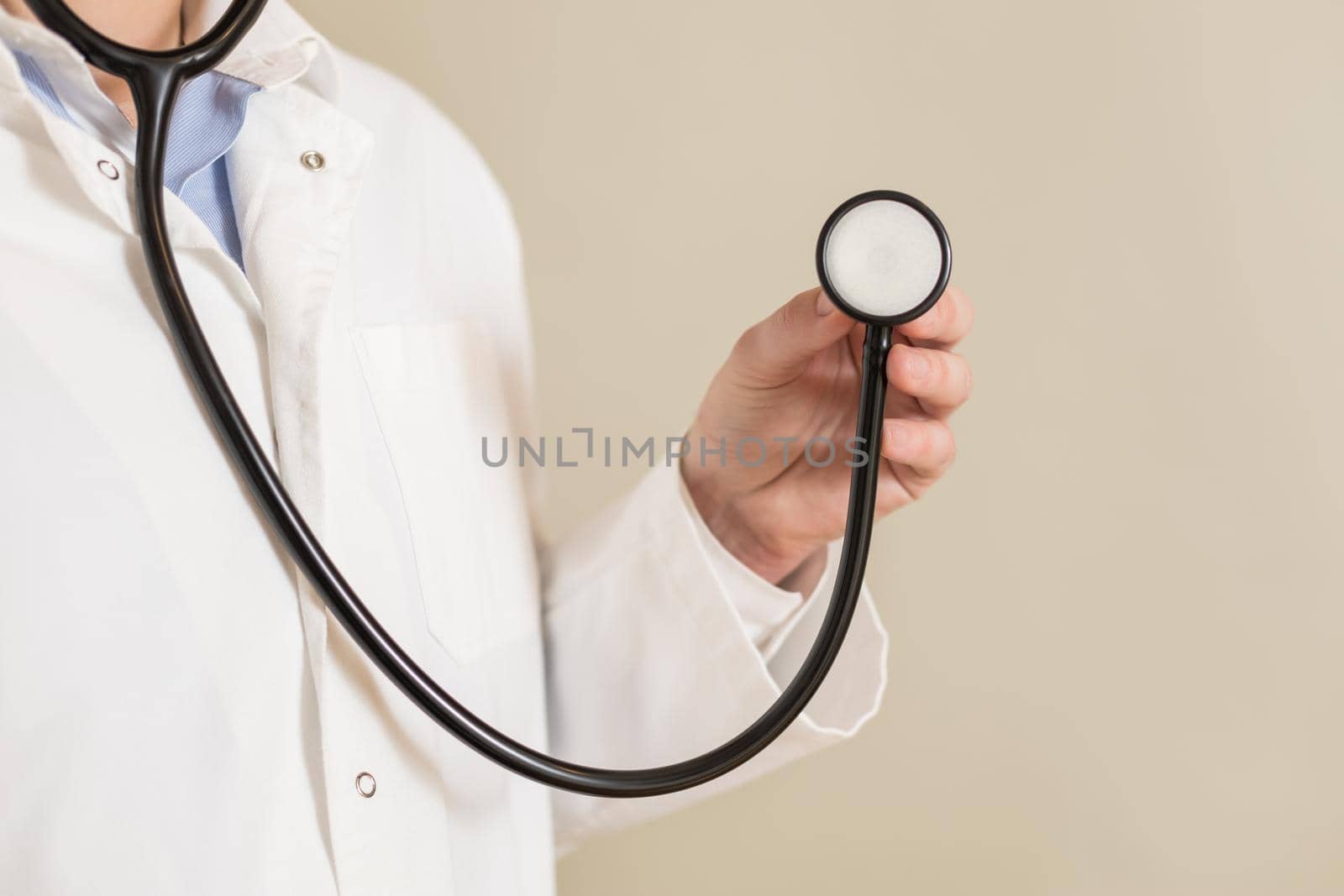 Image of male doctor holding stethoscope.