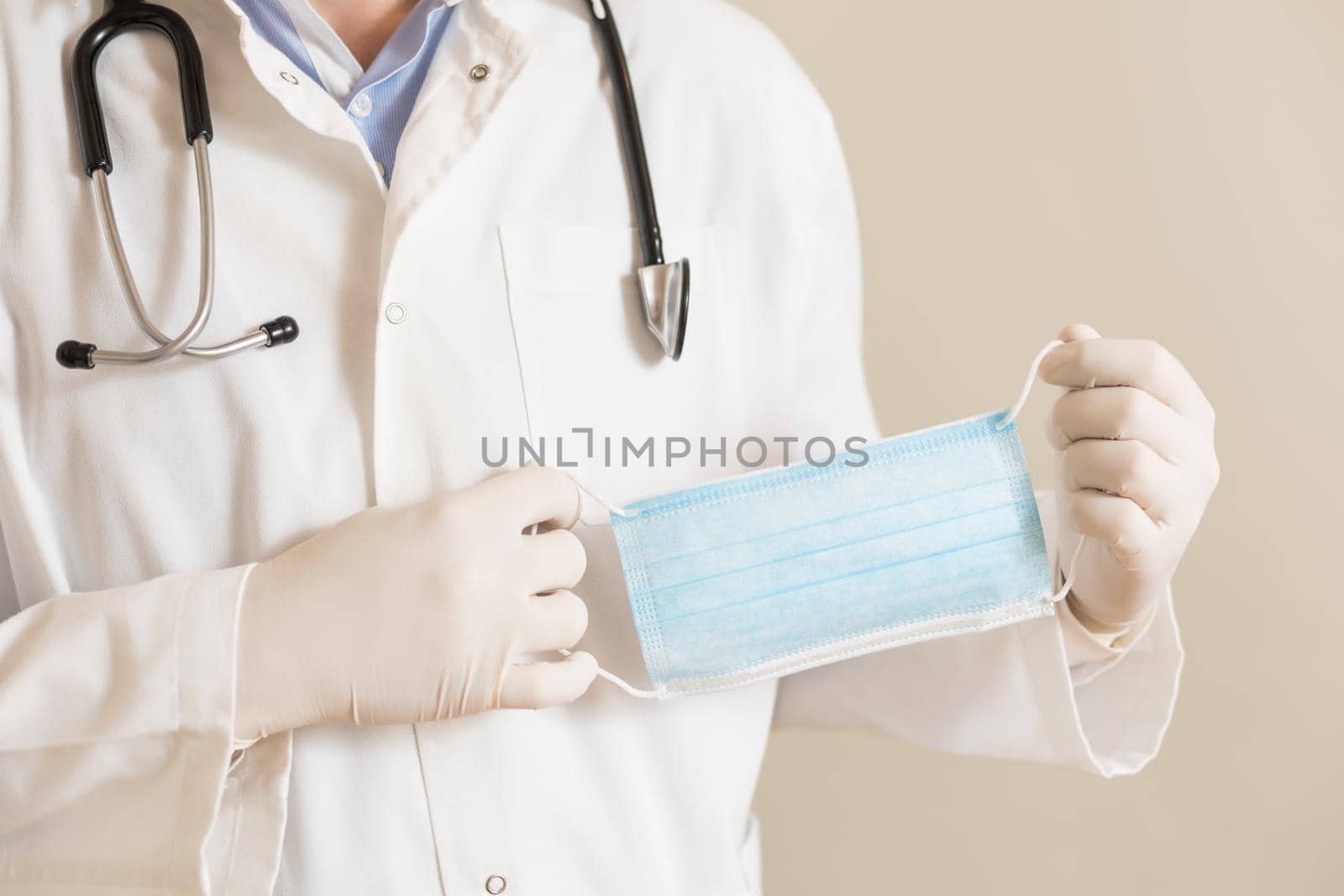 Male doctor showing surgical mask by Bazdar
