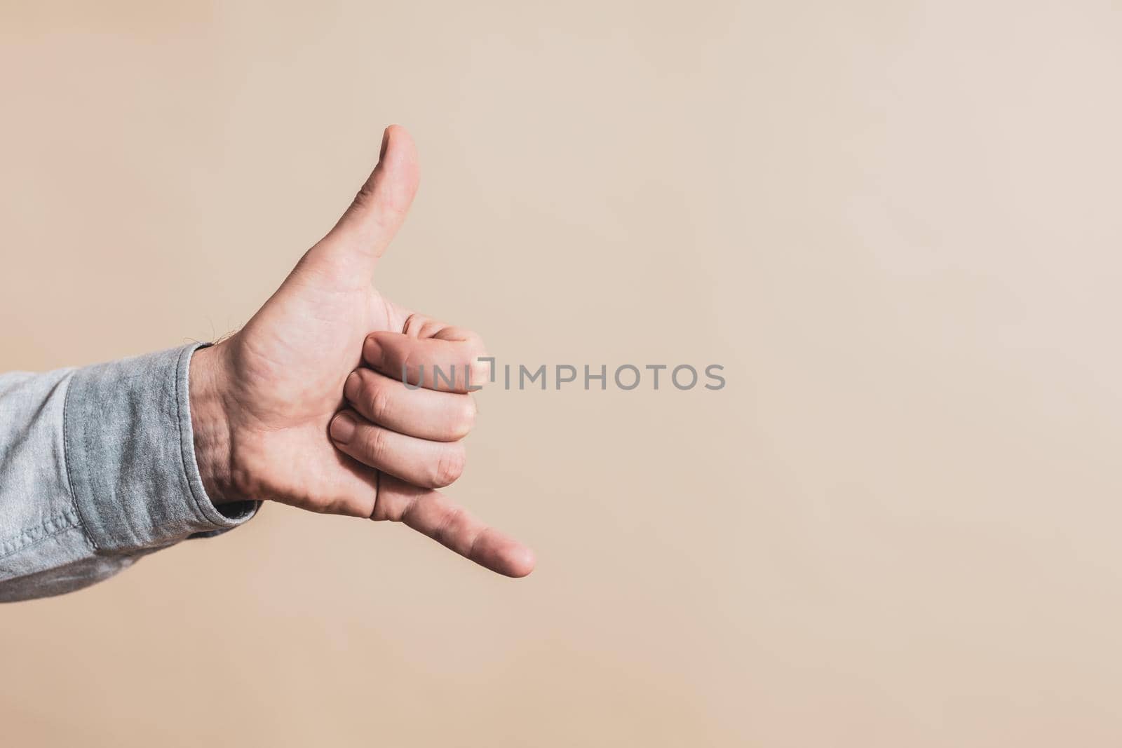 Male hand showing call me gesture by Bazdar