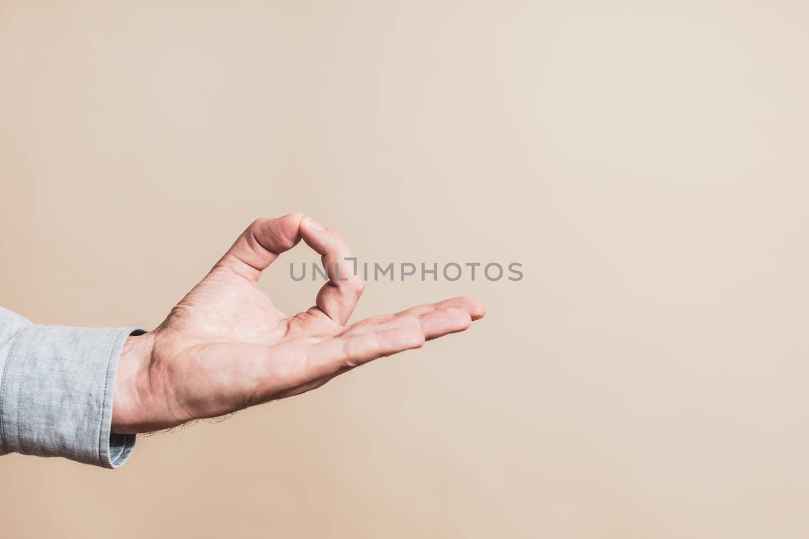 Close up  of  male hand meditating by Bazdar