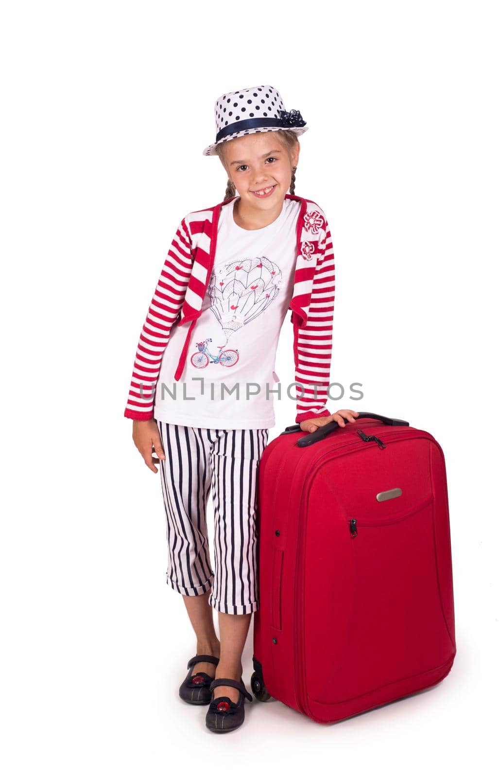 Portrait of little girl with travel case and hat isolated on white by aprilphoto