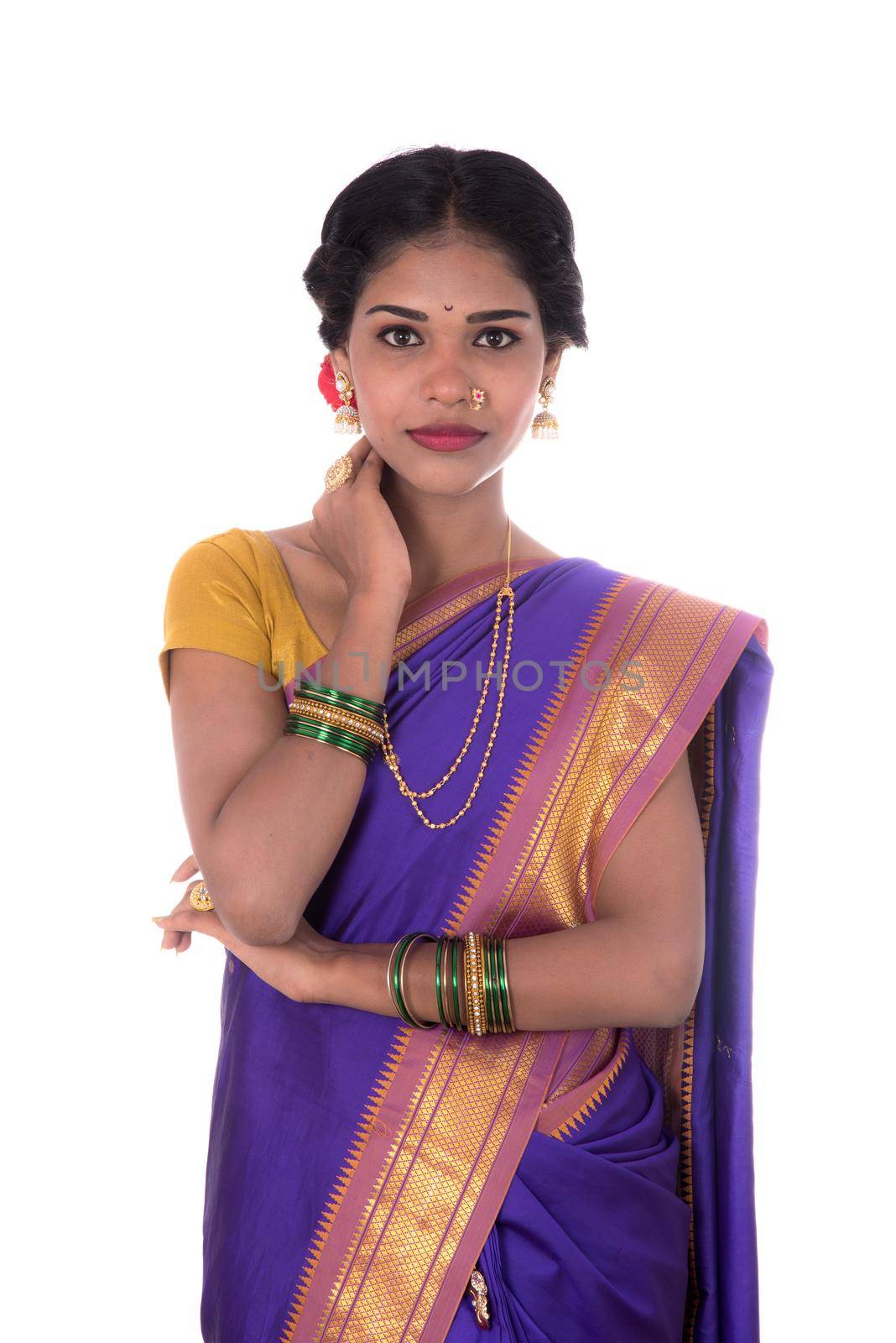 Beautiful Indian young girl posing in traditional Indian saree on white background. by DipakShelare