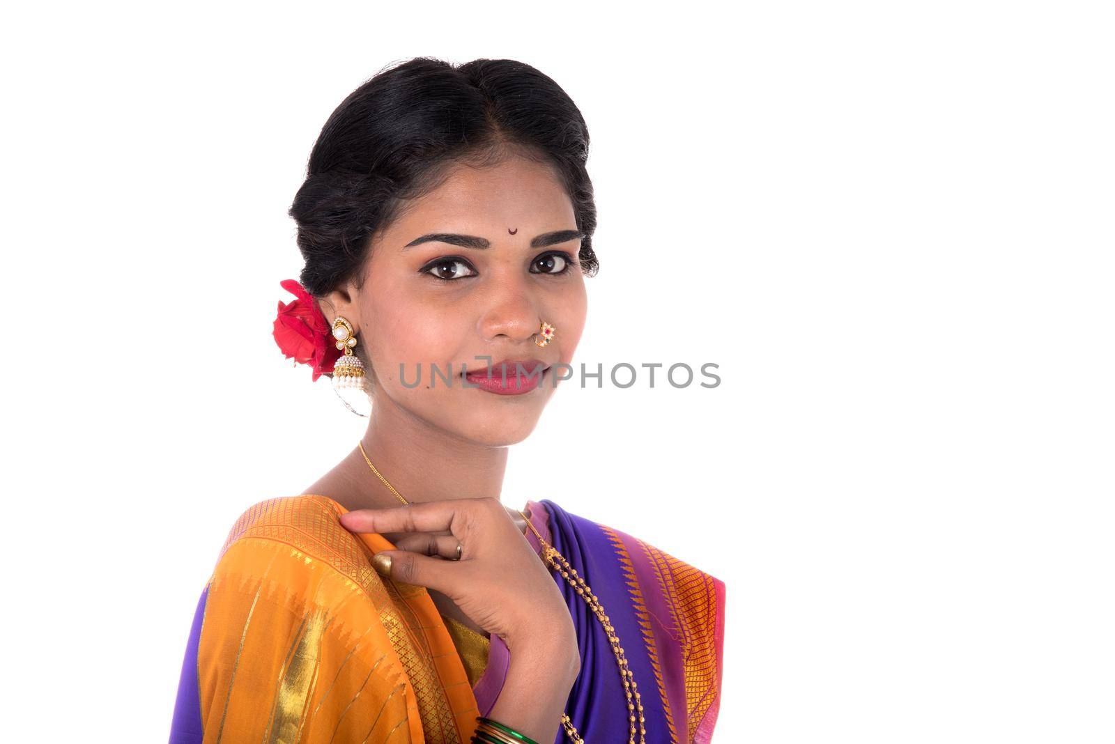 Beautiful Indian young girl posing in traditional Indian saree on white background. by DipakShelare