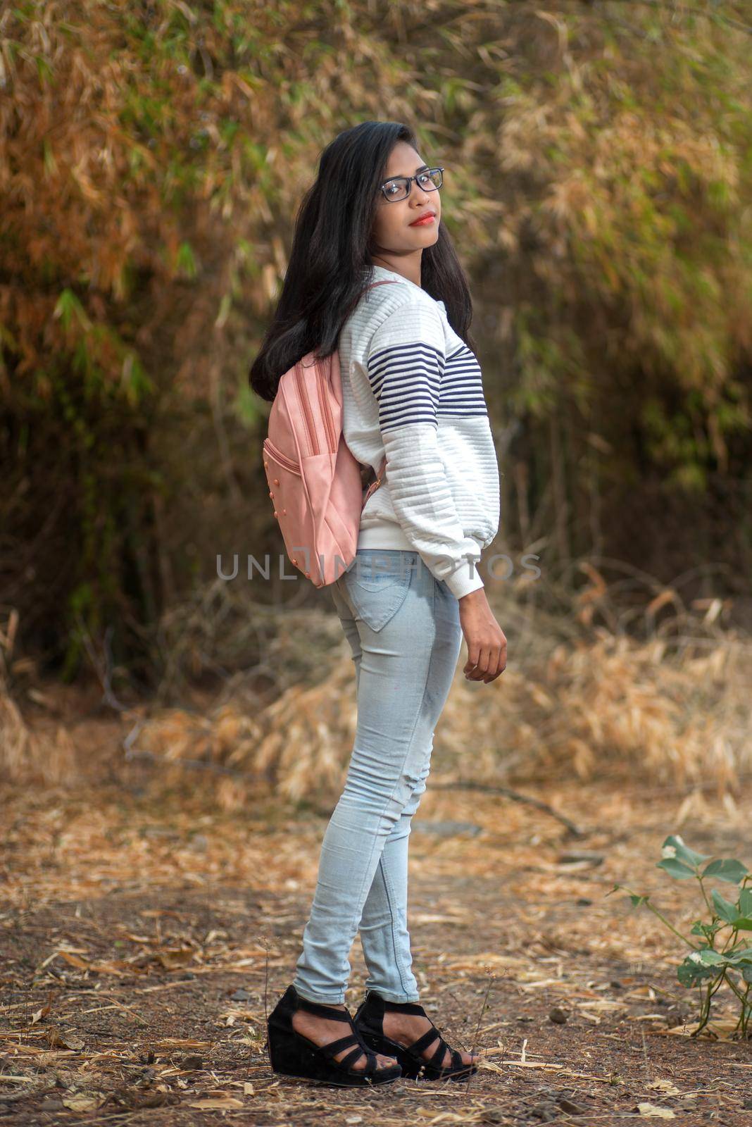 young girl standing and having fun in outdoors