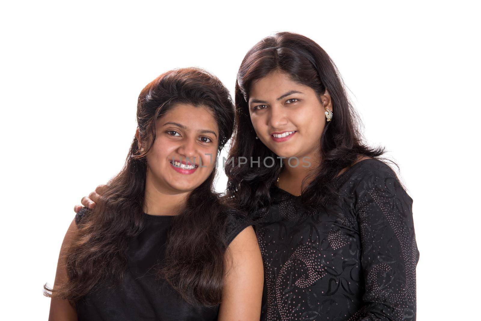 Portrait of happy young girls on a white background
