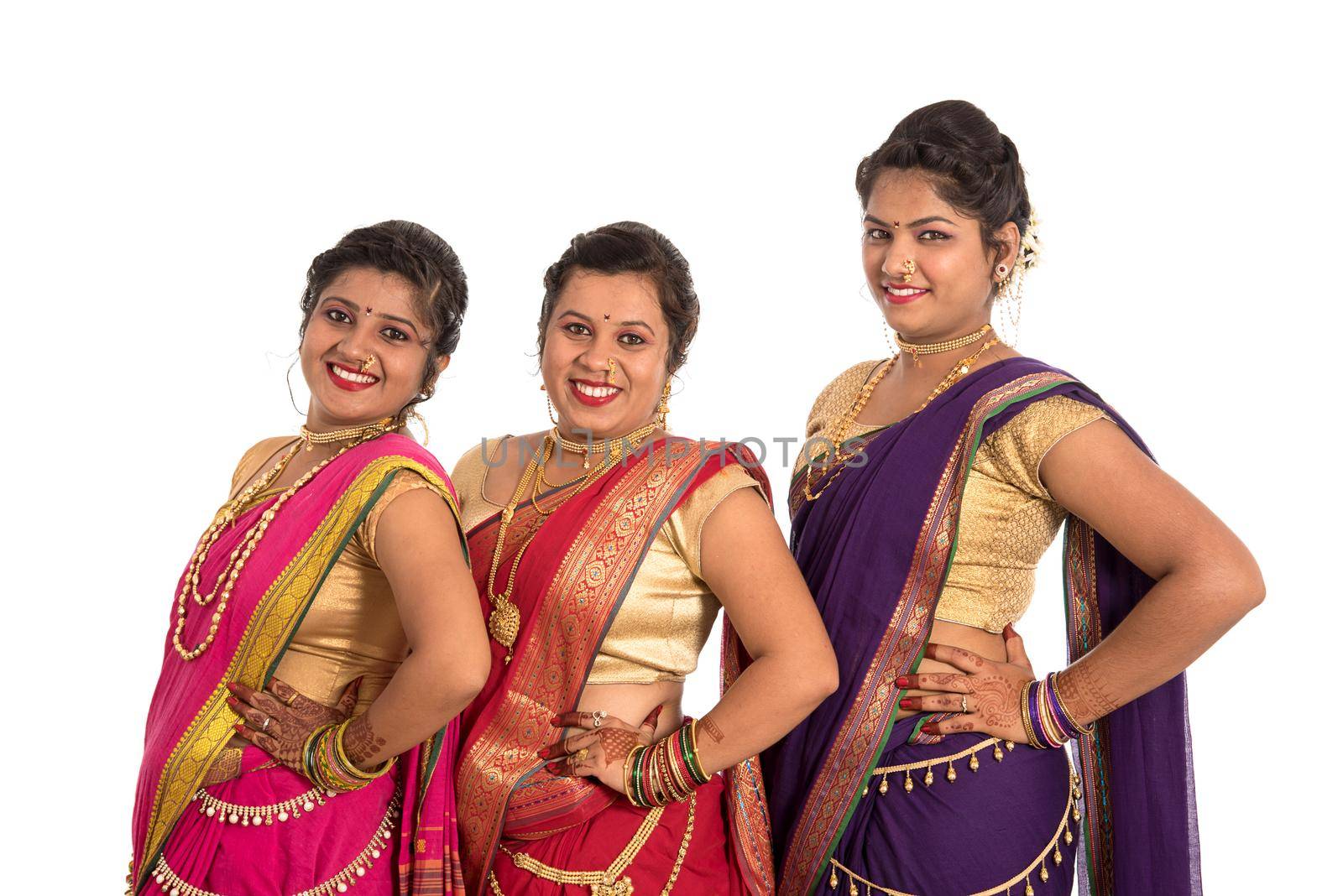 Traditional Beautiful Indian young girls in saree posing on white background by DipakShelare