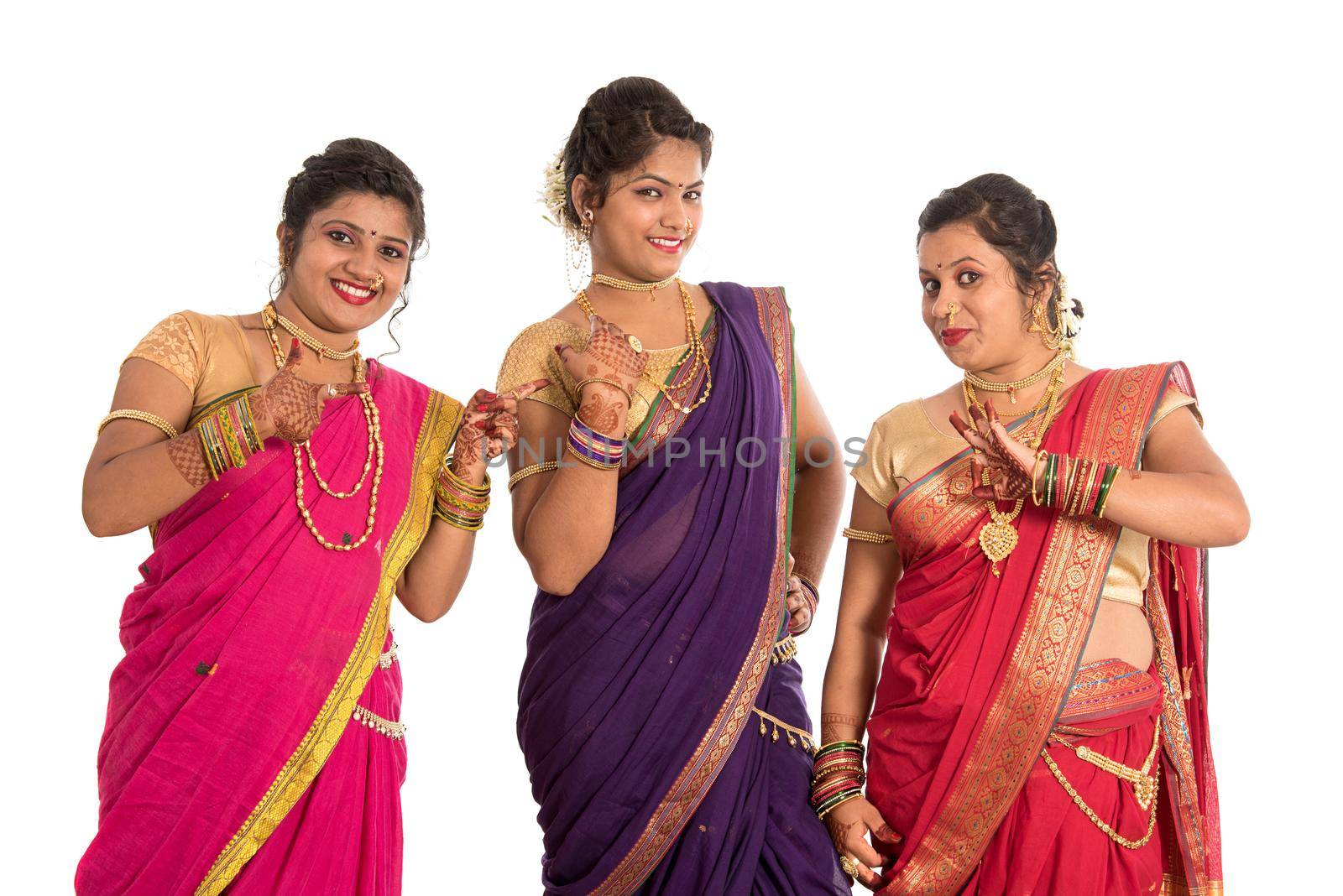 Traditional Beautiful Indian young girls in saree posing on white background by DipakShelare