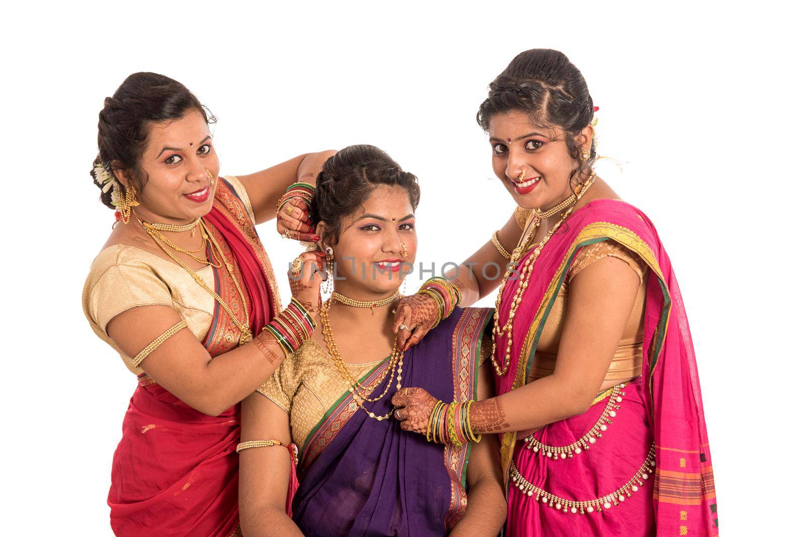 Traditional Beautiful Indian young girls in saree posing on white background