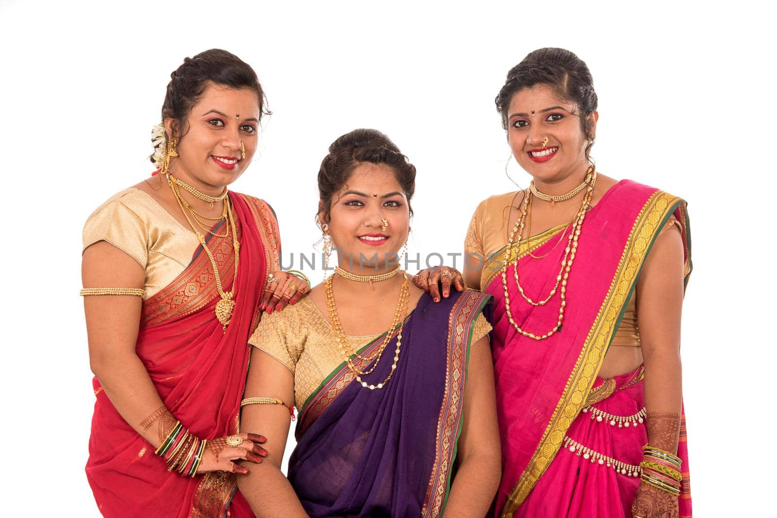 Traditional Beautiful Indian young girls in saree posing on white background