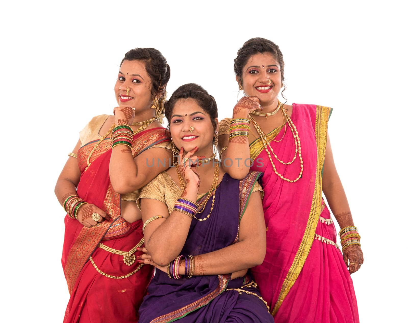 Traditional Beautiful Indian young girls in saree posing on white background by DipakShelare