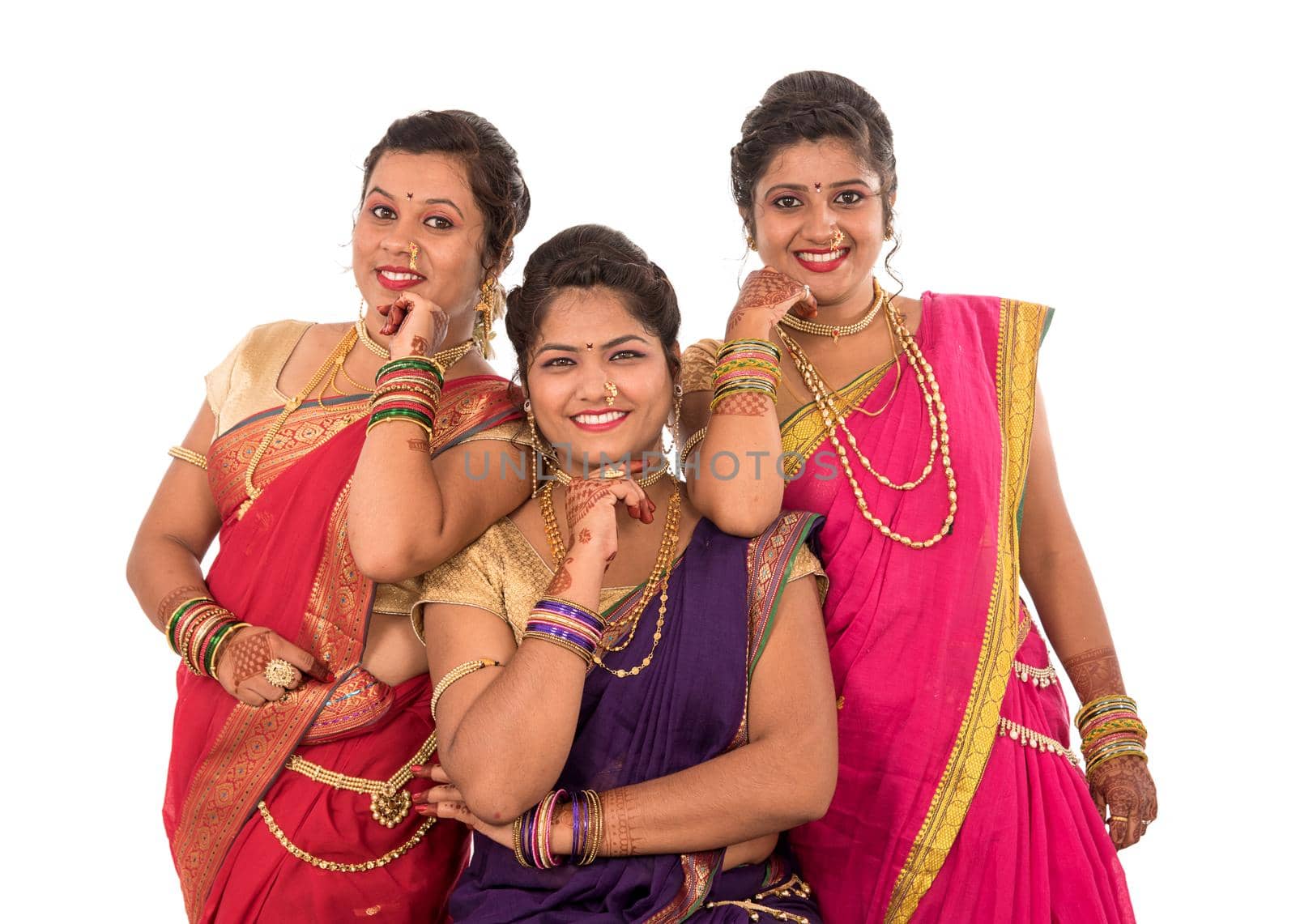 Traditional Beautiful Indian young girls in saree posing on white background by DipakShelare