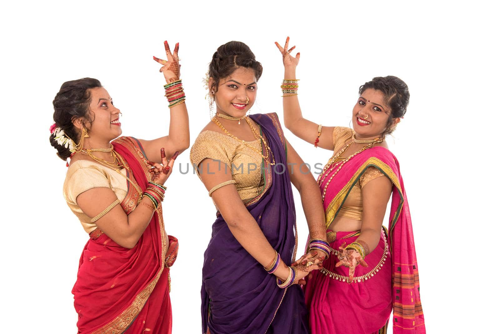 Traditional Beautiful Indian young girls in saree posing on white background by DipakShelare