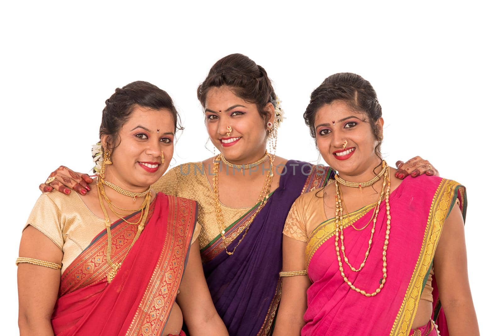 Traditional Beautiful Indian young girls in saree posing on white background by DipakShelare